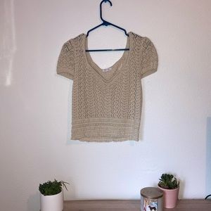 Short sleeve, v-neck, tan knit sweater. Size Large. Brand new never worn.